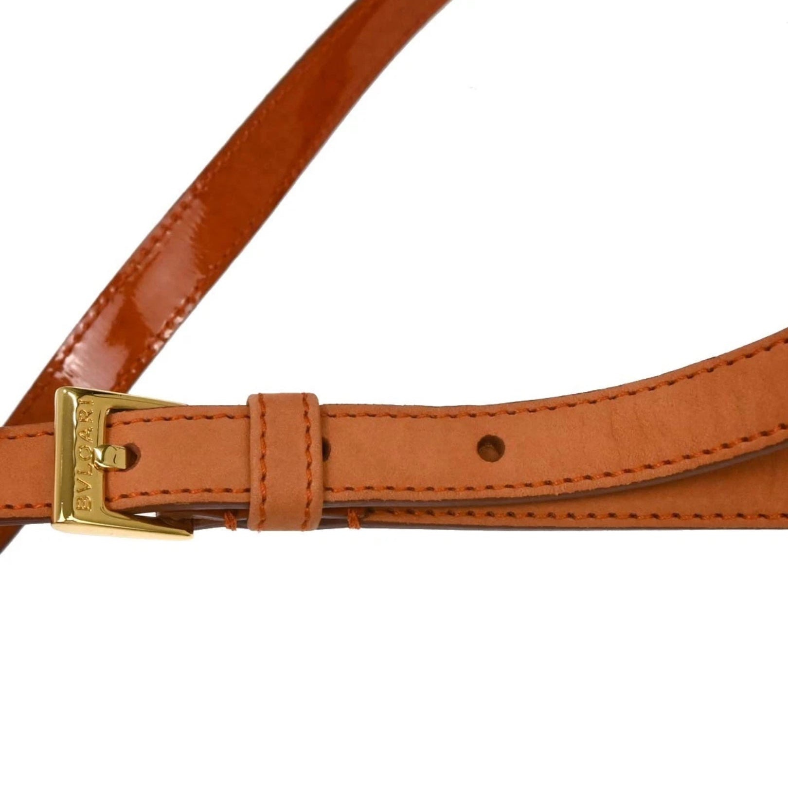 leather belt with a gold buckle
