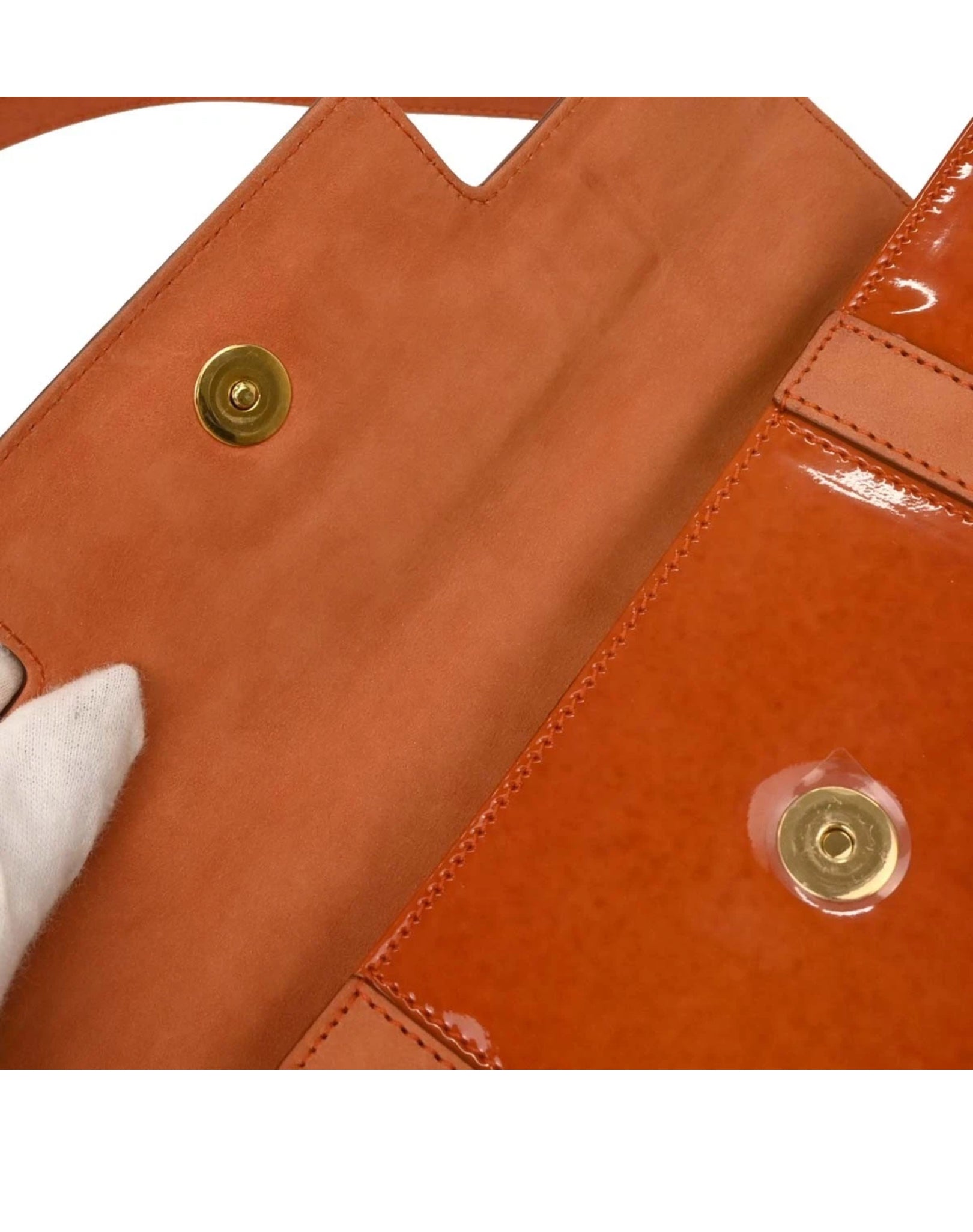 Close-up of  leather bag with gold rivets 