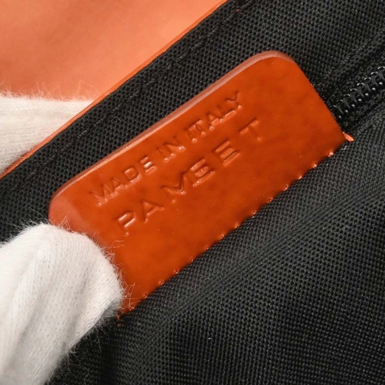 Close-up of back side of brand label 